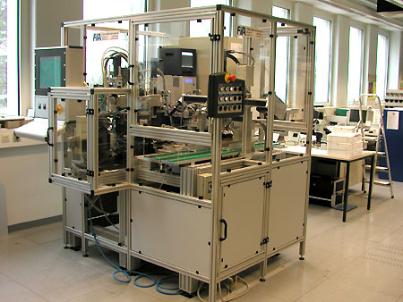 Punching and welding automat for satellite solar cells